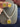 Yellow doublet CZ necklace set with matching stud earrings on display stand