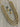 Gold colorway of the 3-strand crystal beaded mala set laid flat