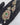 Gold-tone CZ pendant with green centre stone, ruby-pink border and leaf motif, with matching earrings