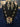 Victorian polki navratan pendant chain necklace set with matching earrings in multicolor green on a black display bust