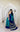 Model wearing pure Gajji silk bandhani saree in teal green and royal blue with gold tissue pallu and white lace border