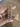 Antique gold bangles with champagne stones held by a jewelry model