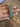 CZ bangles with emerald green oval stones held by a jewelry model