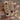 Gold openwork kada bangles with ruby cushions held by a jewelry model