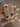 Gold openwork kada bangles with ruby cushions held by a jewelry model
