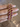 Ruby pink zigzag CZ bangles held by a jewelry model