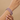 Model wearing ruby red round stone CZ bangles on her wrist