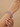 Model wearing ruby red round stone CZ bangles on her wrist
