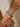 Model wearing emerald green oval CZ bangles on her wrist