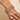 Model wearing antique gold rani pink stone bangles on her wrist