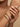 Model wearing gold lattice kada bangle with CZ paisley tips on her wrist