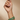 Model wearing emerald green oval statement bangles on her wrist