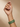 Model wearing emerald green oval statement bangles on her wrist