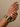 Model wearing emerald green cushion stone bangles on her wrist