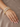 Model wearing white CZ oval statement bangles on her wrist