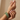 Model wearing slim emerald green CZ bangle set on her wrist