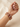 Model wearing ruby red cushion stone bangles on her wrist
