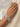 Model wearing silver tone baguette mosaic CZ bangles on her wrist