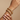 Model wearing gold jali kundan pearl white bangles on her wrist