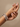 Model wearing rose gold and gunmetal baguette mosaic bangles