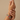 Model wearing ruby baguette bangles with emerald accents on her wrist