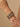 Model wearing green meenakari kundan kada bangles on her wrist