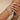 Model wearing princess-cut CZ double-row bangle set on her wrist