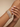 Model wearing princess-cut CZ double-row bangle set on her wrist