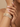 Model wearing champagne CZ cluster bangle set on her wrist