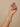 Model wearing emerald-cut white CZ bangle set on her wrist