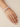 Model wearing round solitaire CZ bangles on her wrist