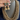 Gold 3-strand crystal-studded beaded mala with jhumka earrings on display stand