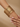 Model wearing the gold textured metal bangle stack on her wrist