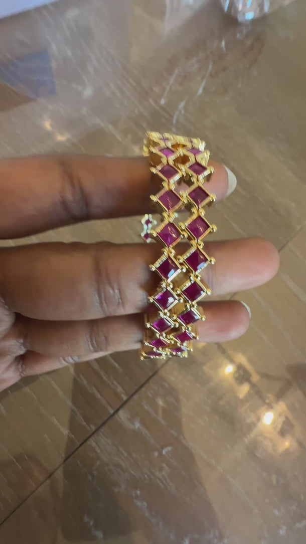 Video of ruby pink zigzag CZ bangles showing pattern and shine in motion