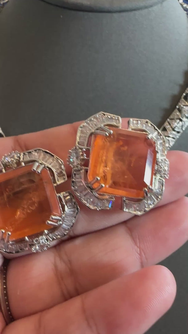 Video of the orange Italian designer doublet CZ necklace set with soft background music