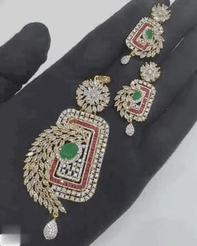 Video of American diamond pendant set with emerald and ruby accents