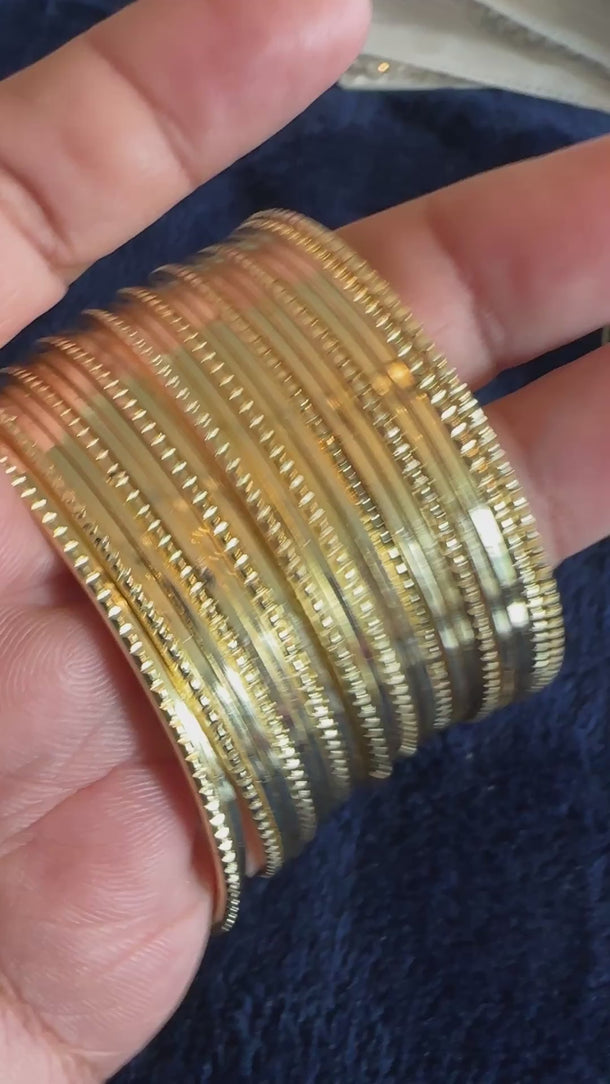 Video of the gold textured metal bangle stack with soft background music