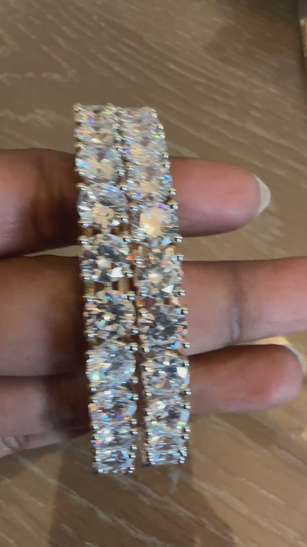 Video of round solitaire CZ bangles showing diamond-like brilliance in motion
