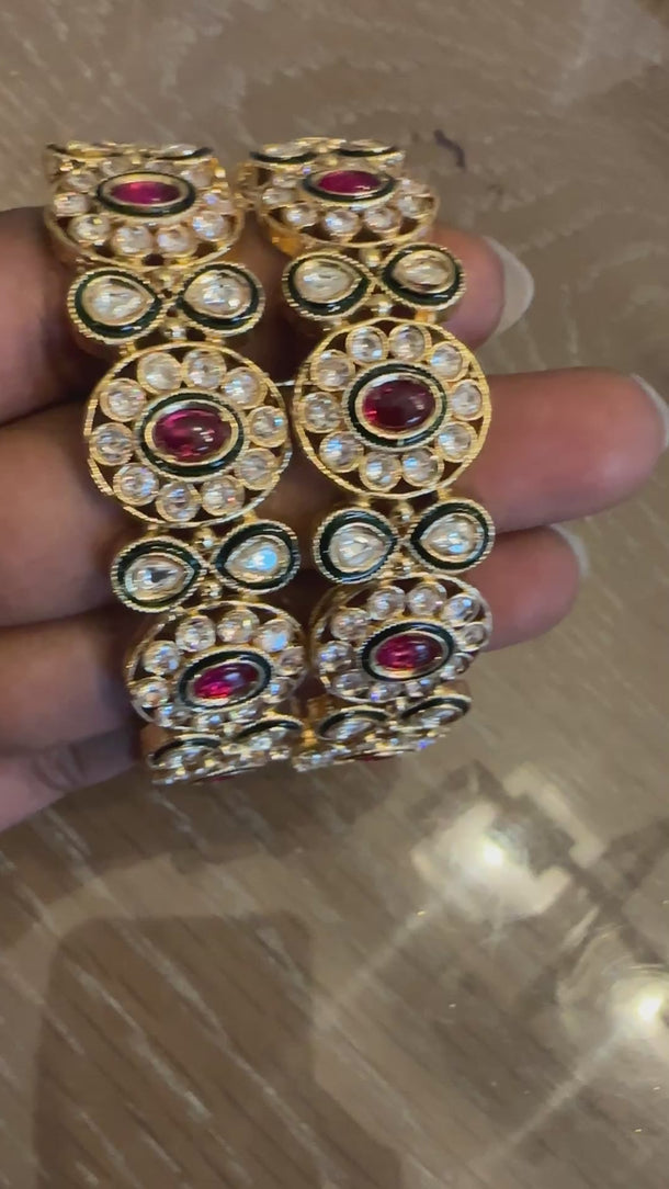 Video of kundan polki kada bangles with ruby stones showing uncut-stone glow