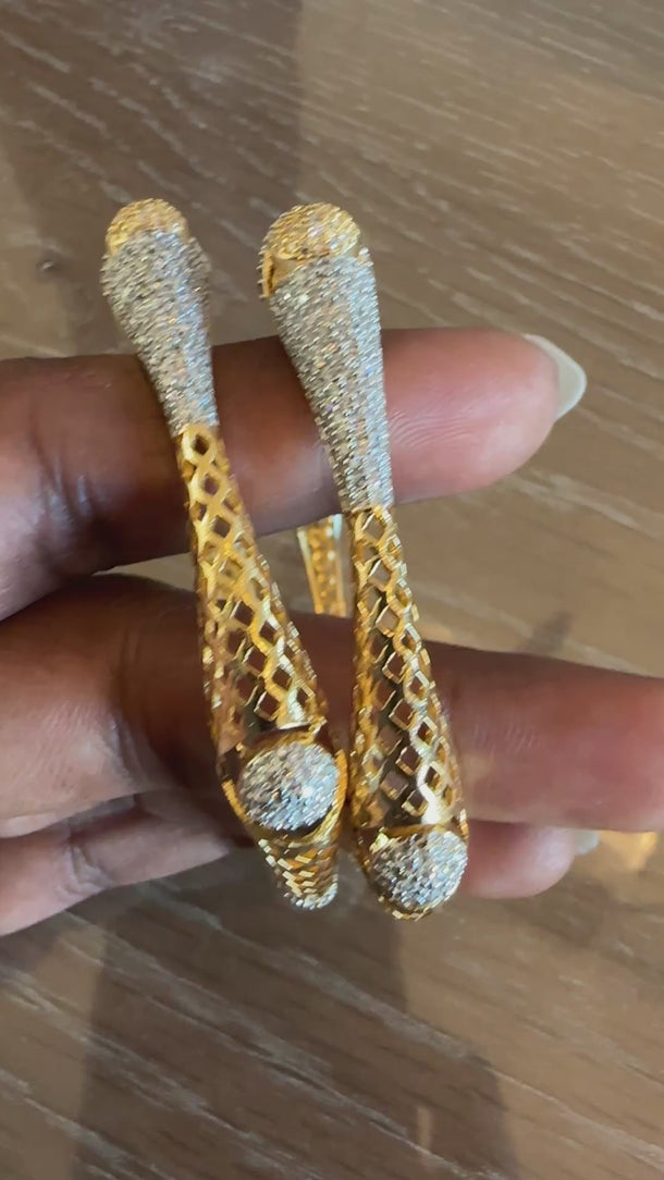 Video of gold lattice kada bangles with CZ paisley tips showing sparkle in motion