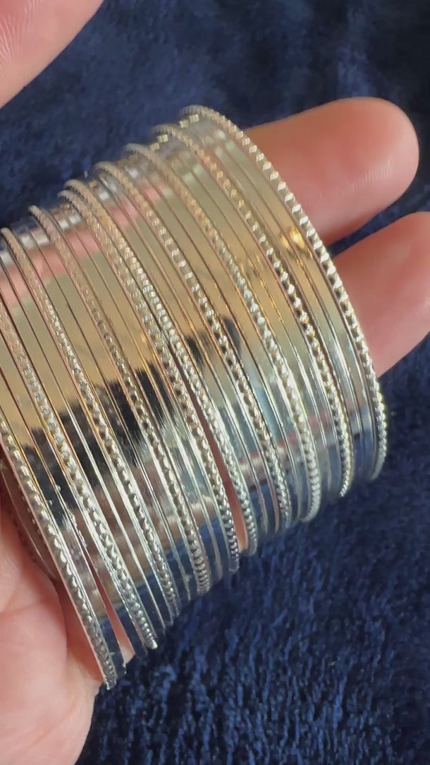 Video of the silver textured metal bangle stack with soft background music